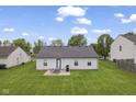Spacious backyard with a patio area, perfect for outdoor dining and entertaining with ample space for recreation at 1431 Evergreen Dr, Greenfield, IN 46140