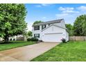 Charming two-story home with a well-manicured lawn and attached two-car garage at 14638 Deerwood Dr, Carmel, IN 46033