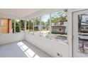 Bright sun room with expansive windows offering street views and natural light at 1661 S Talbott St, Indianapolis, IN 46225