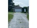 View of detached one car garage accessible via a gravel driveway at 1925 W State Road 32, Lebanon, IN 46052