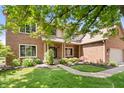 Charming brick home featuring a well-kept lawn and lush greenery in a suburban setting at 3823 Brigade Cir, Carmel, IN 46032