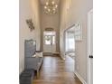 Grand entryway with chandelier lighting, hardwood floors, and decorative accents at 4061 Secretariat Ln, Bargersville, IN 46106