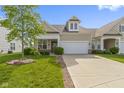 Inviting exterior elevation of a single-Gathering home with a well-manicured lawn and an attached two-car garage at 4181 Gordman Dr, Whitestown, IN 46075
