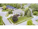 Aerial view of the home showcasing its prime location, landscaped yard, and neighborhood at 434 Sheffield Ct, Carmel, IN 46032