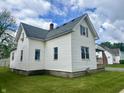 Well-kept home showcasing traditional siding, neat landscaping, and a cozy, inviting appeal at 600 S Oak St, Fortville, IN 46040