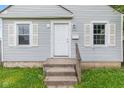 Close-up of the home's entrance highlighting the classic white door and inviting front porch at 703 Kappes St, Indianapolis, IN 46221