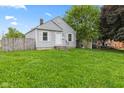Quaint single-story home featuring a cozy front yard, classic siding, and inviting curb appeal at 703 Kappes St, Indianapolis, IN 46221
