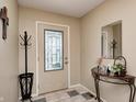 Welcoming entryway featuring a decorative glass door, tile flooring, and ample space at 8206 Bull Run Ct, Indianapolis, IN 46227