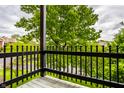 Relaxing outdoor view from the balcony, showcasing the scenic surrounding greenery and neighborhood at 8690 Jaffa Ct W Dr # 28, Indianapolis, IN 46260