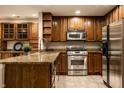 Well-equipped kitchen featuring stainless steel appliances, granite countertops, and ample cabinet space at 8690 Jaffa Ct W Dr # 28, Indianapolis, IN 46260