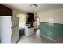 Well-lit kitchen with white appliances and a view of the arched doorway at 1739 Crystal St, Anderson, IN 46012