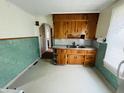Vintage kitchen featuring ample cabinet space and retro tiling at 1739 Crystal St, Anderson, IN 46012