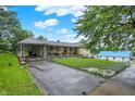 Expansive driveway and well-maintained lawn of this charming home at 313 E South St, Morristown, IN 46161