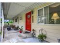 Inviting front porch with decorative plants and comfortable seating area at 313 E South St, Morristown, IN 46161