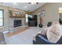 Inviting living room with a brick fireplace, comfortable seating, and neutral decor at 3630 Foxtail Dr, Indianapolis, IN 46235