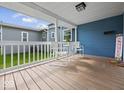 Inviting front porch with white railings and a cozy seating area to enjoy the outdoors at 547 W Taylor St, Shelbyville, IN 46176