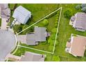 Aerial view of home on a meticulously landscaped lot in a suburban neighborhood at 6026 Pennyworth Cir, Indianapolis, IN 46203