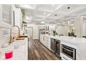 Spacious kitchen featuring marble countertops, stainless steel appliances, and coffered ceilings at 6230 E 56Th St, Indianapolis, IN 46226
