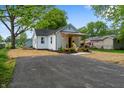 Renovated white brick home with a cozy front porch and inviting curb appeal at 650 Overstreet St, Franklin, IN 46131