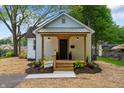 Charming renovated home featuring a cozy porch and well-manicured landscaping at 650 Overstreet St, Franklin, IN 46131
