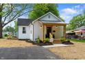 White brick home with new landscaping and a driveway leading to the entrance at 650 Overstreet St, Franklin, IN 46131