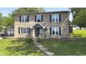 Charming two-story brick home with black shutters and a welcoming front entrance at 80 E College Ave, Martinsville, IN 46151