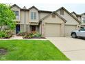 Charming townhome with well-manicured lawn and attached two-car garage at 9154 Sea Oats Dr, Indianapolis, IN 46250