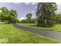 Expansive green property with a long paved driveway leading to the house at 1190 W Jefferson St, Franklin, IN 46131