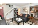Comfortable living room with stairs and an open view to the kitchen at 1236 Central Ave, Indianapolis, IN 46202