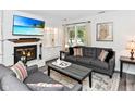 Inviting living room with a fireplace, neutral decor, comfortable seating, and ample natural light at 1236 Central Ave, Indianapolis, IN 46202