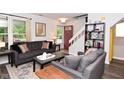 Inviting living room featuring stylish sofas and a convenient side table at 1236 Central Ave, Indianapolis, IN 46202