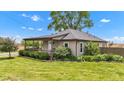 Quaint single-story home with a covered porch and manicured landscaping at 1237 W State Rd 38, Pendleton, IN 46064