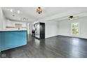 Open-concept living area with modern finishes and dark wood floors at 1237 W State Rd 38, Pendleton, IN 46064