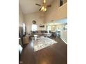 Bright living room features vaulted ceilings, hardwood floors, and a comfortable seating area at 1304 Crescent Dr, Greenwood, IN 46143