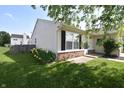 Side view of house with charming lawn and flowerbed at 1652 Sweetwater Ln, Greenfield, IN 46140