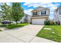 Two story home with stone veneer and siding, two car garage and ample driveway parking at 2473 Shadow Bend Dr, Columbus, IN 47201