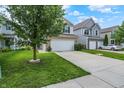 A charming two-story home with a lush lawn and mature tree in a Gathering-friendly neighborhood at 2473 Shadow Bend Dr, Columbus, IN 47201