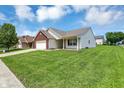 Single-Gathering home with attached garage, manicured lawn, and blue sky at 3222 Enclave Ln, Greenwood, IN 46143