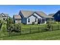 Spacious backyard featuring lush green lawn, privacy fence, and plenty of space for outdoor activities at 3691 Talmine Ln, Bargersville, IN 46106