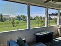 Relaxing screened porch with comfortable seating and a view of the community at 3691 Talmine Ln, Bargersville, IN 46106