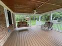 Relaxing covered porch with a ceiling fan, swing, and bench, perfect for enjoying the outdoors at 5725 W 200 N, Lebanon, IN 46052