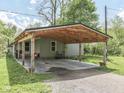 Close-up of a house with a spacious, covered carport, ideal for protecting vehicles from the elements at 6091 Mt Moriah Rd, Nineveh, IN 46164