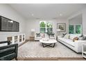 Stylish living room with ample natural light, modern decor, and comfortable seating arrangements at 6833 Jacone Dr, Brownsburg, IN 46112