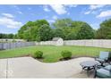 Spacious backyard with a lush green lawn, a privacy fence, patio and comfortable seating area at 7242 Blue Ridge Dr, Noblesville, IN 46062
