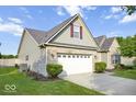 Charming single-Gathering home with well-maintained lawn, mature trees, and a two-car garage at 7242 Blue Ridge Dr, Noblesville, IN 46062