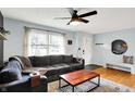 Cozy living room featuring a comfortable couch, hardwood floors, and ample natural light at 820 S Eaglewood Dr, Zionsville, IN 46077