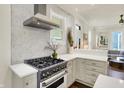 Modern kitchen featuring stainless steel appliances, stylish tile backsplash, and bright lighting at 847 N Park Ave, Indianapolis, IN 46202