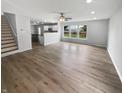 Spacious living room featuring new floors, recessed lighting, and a ceiling fan at 10366 Camby Xing, Fishers, IN 46038