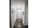 Bright entryway with beautiful dark wood floors and neutral wall paint throughout at 10447 Pintail Ln, Indianapolis, IN 46239