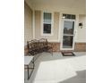 Charming porch area with a stylish metal bench, perfect for relaxing outdoors at 10447 Pintail Ln, Indianapolis, IN 46239